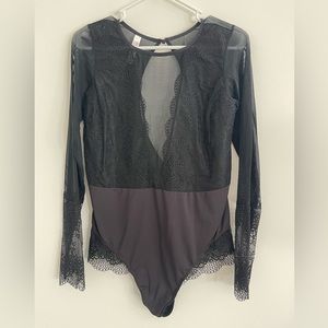Beautiful, black, long sleeved, lace bodysuit. Size XL.